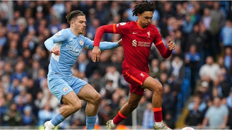 Manchester City's Jack Grealish (left) and Liverpool's Trent Alexander-Arnold battle for the ball