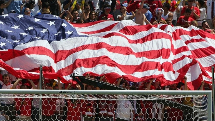 Fans hold up the American flag during a game