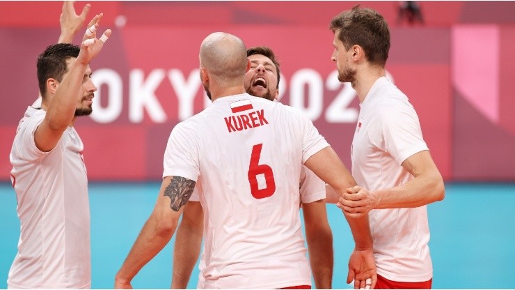 Bartosz Kurek of the Poland national team reacts with his teammates