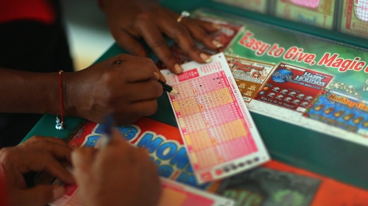 A customer fills out a Powerball lottery ticket