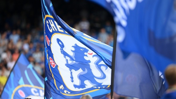 Chelsea fans wave flags prior to the Premier League match between Chelsea FC and West Ham United at Stamford Bridge on September 03, 2022 in London, England.