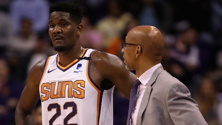 DeAndre Ayton of the Phoenix Suns stands with head coach Monty Williams
