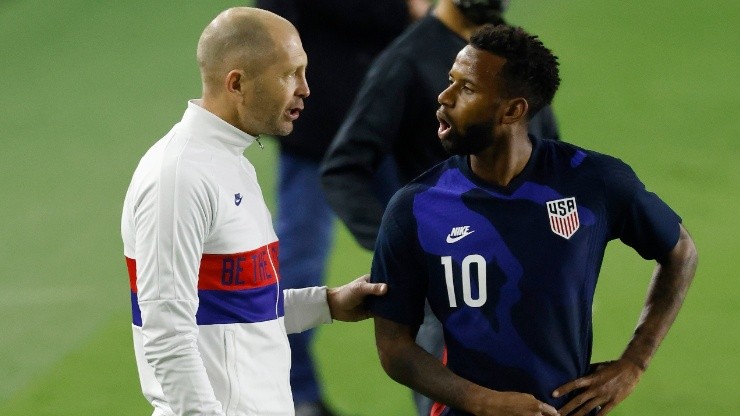 Head coach Gregg Berhalter of the United States talks with Kellyn Acosta #10 against El Salvador during the second half at Inter Miami CF Stadium on December 09, 2020 in Fort Lauderdale, Florida.