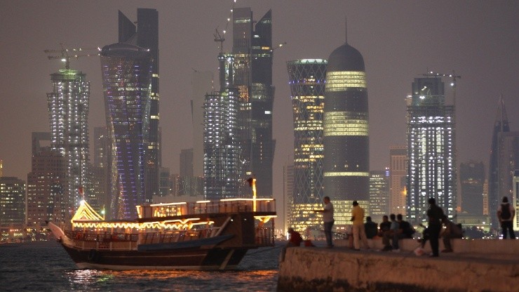 People fish along the waterfront along the Persian Gulf in Doha, Qatar.