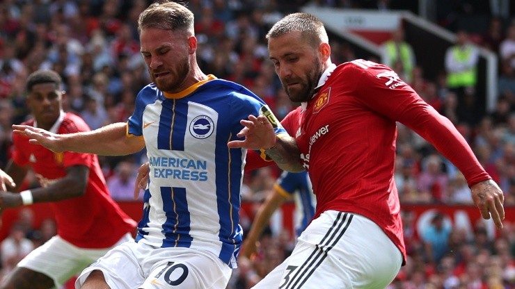 Alexis Mac Allister of Brighton and Luke Shaw of Manchester United