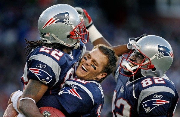 Asante Samuel y Tom Brady