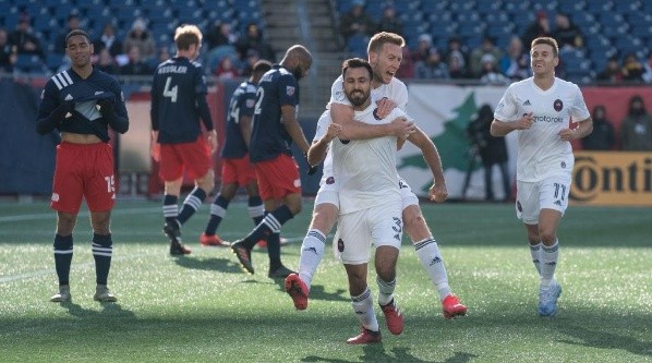 Jonathan Bornstein #3 of Chicago Fire celebrates with teammates after scoring a goal against New England Revolution (Getty).