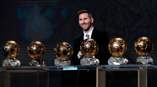 Messi with his Ballon d’Or awards (Getty).