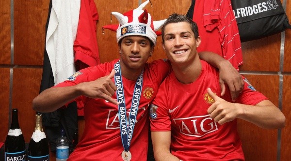 Nani and Cristiano Ronaldo of Manchester United celebrate in the dressing room (Getty).