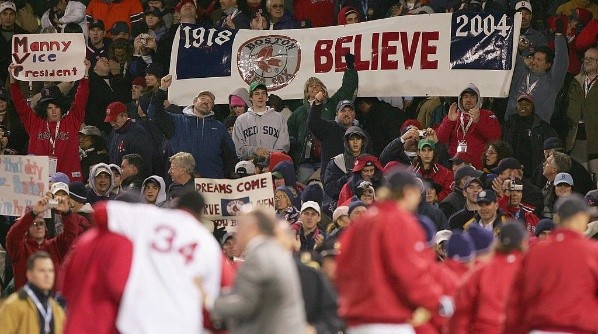 The Boston Red Sox fans celebrate as the Red Sox defeated the St. Louis Cardinals 11-9 to win game one of the World Series. (Getty)