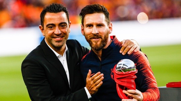 Xavi Hernández y Lionel Messi