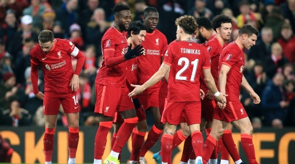 LIVERPOOL, ENGLAND - MARCH 02: Divock Origi of Liverpool (2L), Takumi Minamino of Liverpool (3L) and Konstantinos Tsimikas of Liverpool celebrate a goal during the Emirates FA Cup Fifth Round match between Liverpool and Norwich City at Anfield on March 2, 2022 in Liverpool, England. (Photo by Simon Stacpoole/Offside/Offside via Getty Images)-Not Released (NR) EDITORIAL USE ONLY. No use with unauthorized audio, video, data, fixture lists, club/league logos or 'live' services. Online in-match use limited to 120 images, no video emulation. No use in betting, games or single club/league/player pub