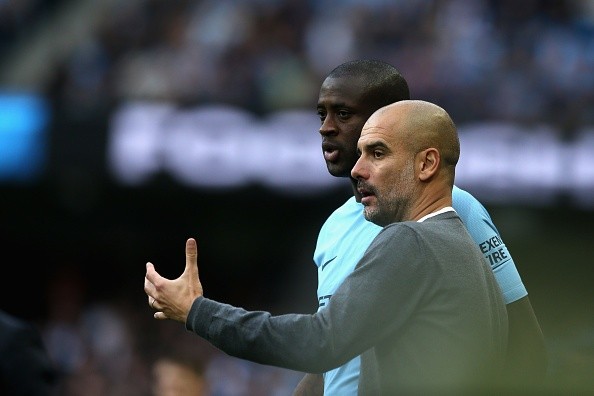 Touré y Guardiola en Manchester City. Getty