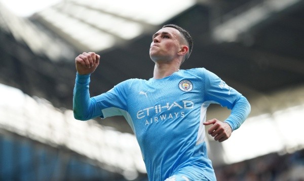 Phil Foden of Manchester City celebrates scoring their side's fourth goal during the Premier League match between Manchester City and Newcastle United at Etihad Stadium on May 08, 2022 in Manchester, England