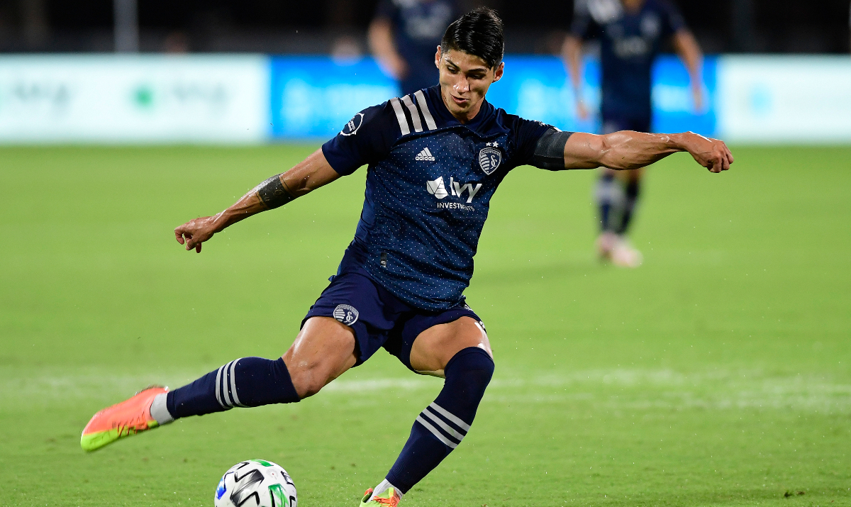REUNION, FLORIDA - JULY 30: Alan Pulido #9 of Sporting Kansas City takes a shot on goal during a quarterfinals match against Philadelphia Union during the MLS Is Back Tournament at ESPN Wide World of Sports Complex on July 30, 2020 in Reunion, Florida. (Photo by Emilee Chinn/Getty Images)