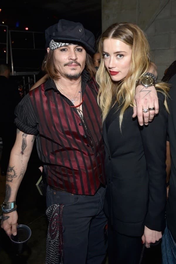 Johnny Depp e Amber Heard enquanto eram casados - Foto: John Shearer/Getty Images