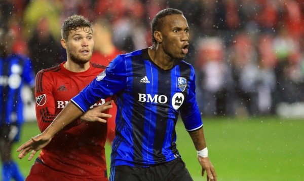 Didier Drogba #11 of Montreal Impact battles with Eriq Zavaleta #15 of Toronto FC during the MLS Eastern Conference Final, Leg 2 game at BMO Field on November 30, 2016 in Toronto, Ontario, Canada. (Photo by Vaughn Ridley/Getty Images)