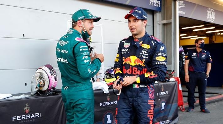 Vettel y Checo tras el último podio juntos. (Getty Images)