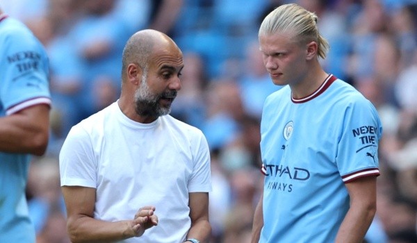 Pep Guardiola y Erling Haaland: Getty