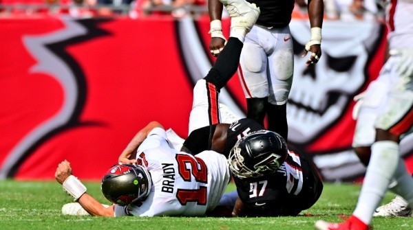 Grady Jarrett (left) taking down Tom Brady in 2022 during a Week 5 game, Bucs vs Falcons