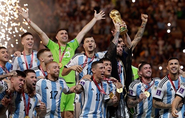 LUSAIL CITY, QATAR - DECEMBER 18: Argentina players celebrate with trophy after the FIFA World Cup Qatar 2022 Final match between Argentina and France at Lusail Stadium on December 18, 2022 in Lusail City, Qatar. (Photo by Richard Sellers/Getty Images) LUSAIL CITY, QATAR - DECEMBER 18: Argentina players celebrate with trophy after the FIFA World Cup Qatar 2022 Final match between Argentina and France at Lusail Stadium on December 18, 2022 in Lusail City, Qatar. (Photo by Richard Sellers/Getty Images)