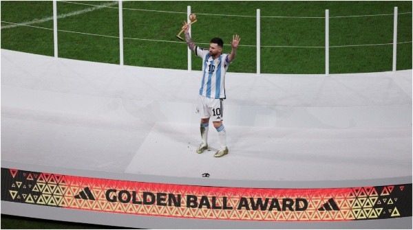 Lionel Messi of Argentina poses for a photo with the adidas Golden Ball award (Richard Heathcote/Getty Images)