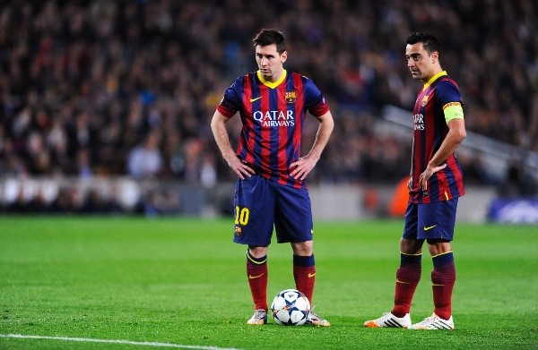 Lionel Messi y Xavi Hernández en su etapa como compañeros en el FC Barcelona. Getty Images