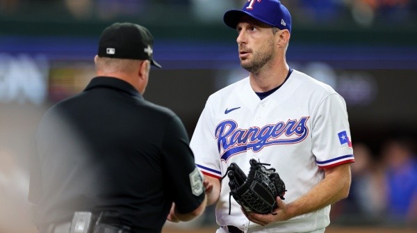 Max Scherzer getting his hand checked by umpire during the 2023 Championship Series against the Houston Astros